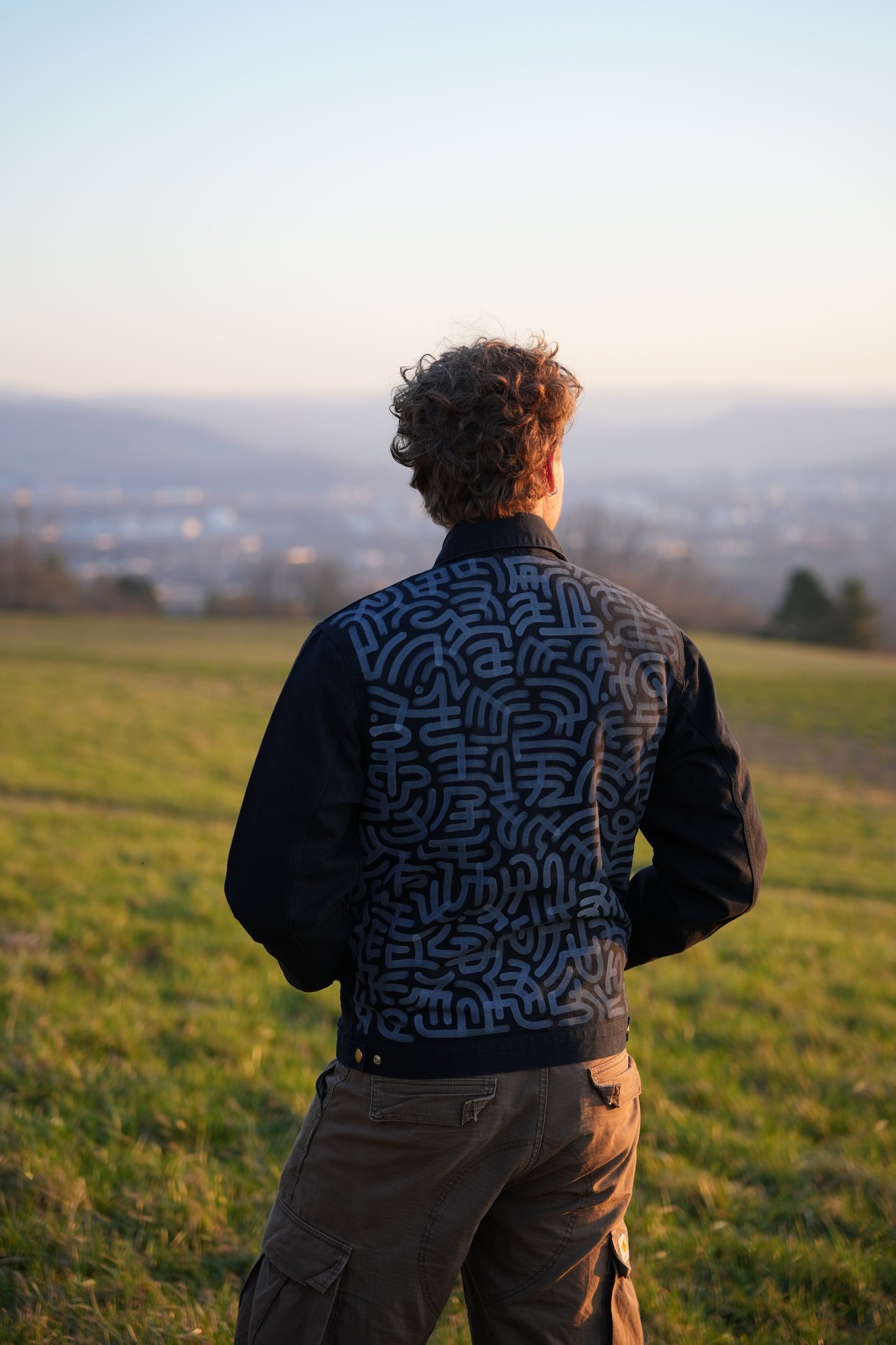 Black Carhartt Jacket with White hand-drawn Scripture