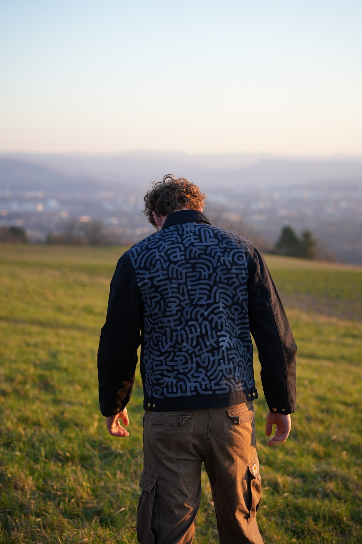 Black Carhartt Jacket with White hand-drawn Scripture
