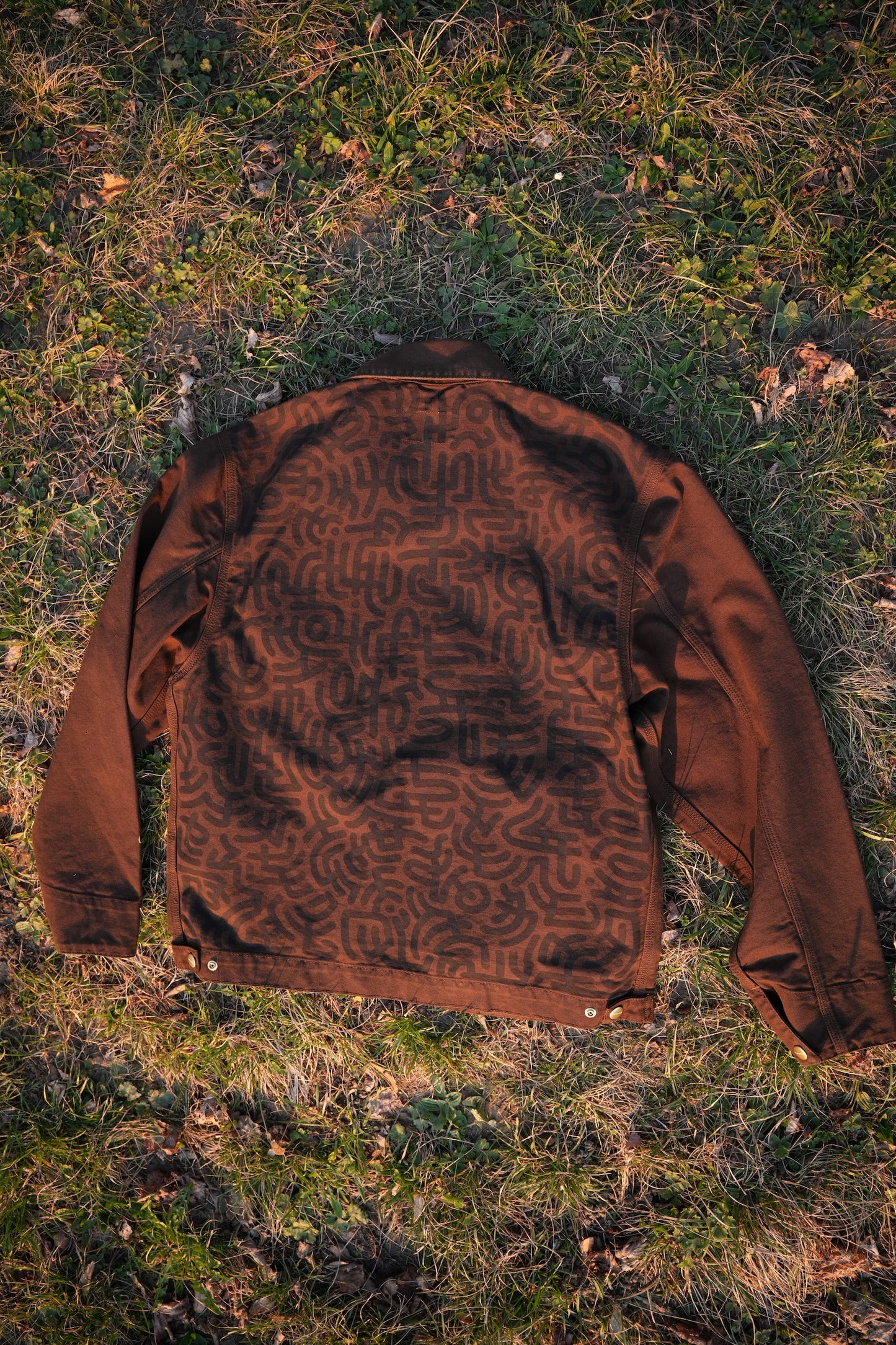 Brown Carhartt Jacket with Black hand-drawn Scripture